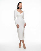 Elegant white dress with long sleeves and slit