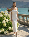 Elegant white dress with a fitted silhouette and a slit for special parties