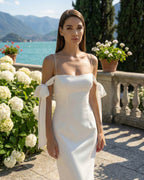 Elegant white dress with a fitted silhouette and a slit for special parties